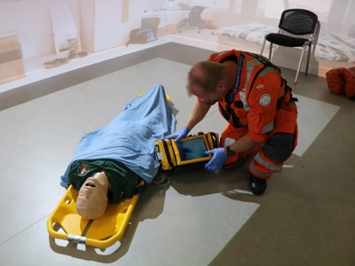 Critical care paramedic Keith Mills participating in training using a mannequin and medical equipment in the charity's simulation suite.