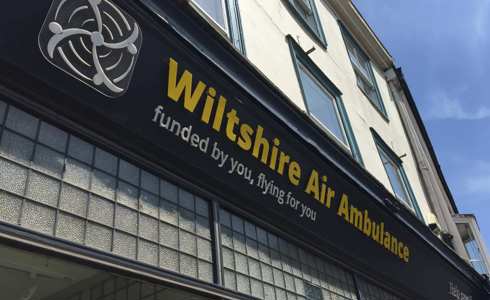 Wiltshire Air Ambulance's Devizes charity shop signage with yellow and white writing