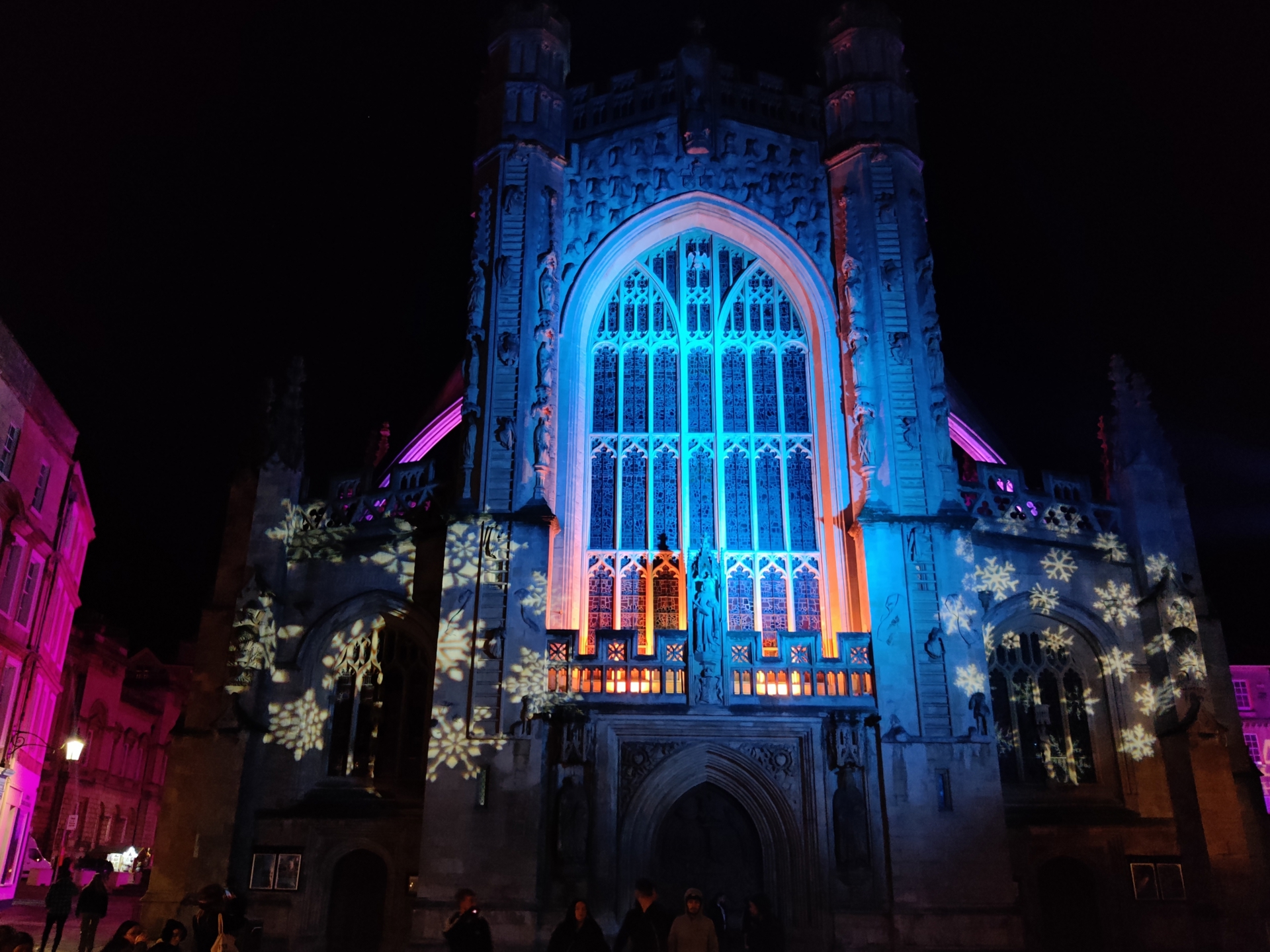 The exterior of Bath Abbey lit up with Christmas lights