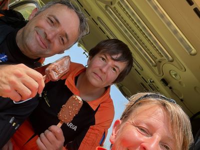 Pilot Matt Wilcock, Dr Maria Smith and Critical care paramedic Lou Cox with ice creams in the Wiltshire Air Ambulance helicopter
