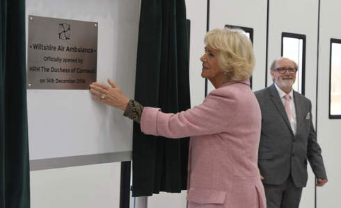 The Queen Consort unveiling the opening plaque for Wiltshire Air Ambulance's new airbase.