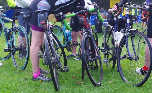 A photo of road bikes and cyclists at an event