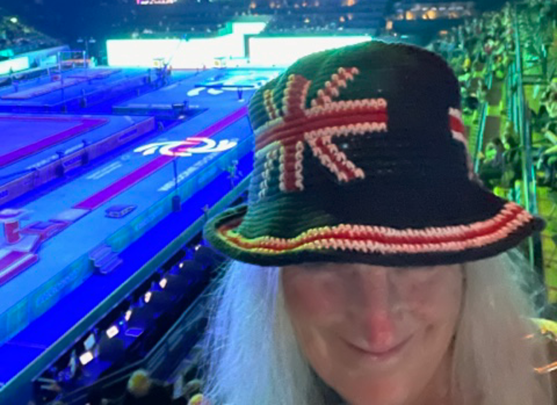 A volunteer wearing a crochet hat featuring the GB flag