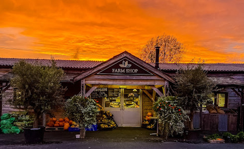 The front of the farm shop at Lowden Garden Centre at sunset